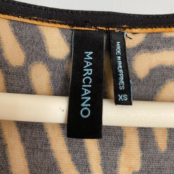 A tiger printed blouse and lower V neckline with a drape style at the front . - Picture 4 of 4